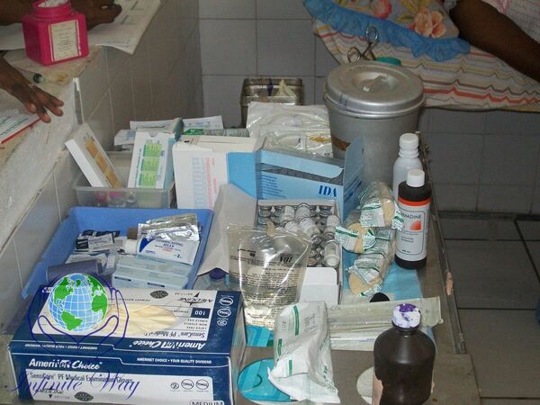 A large crowd of community members gathered at a Haiti relief clinic